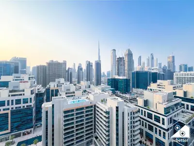 an aerial view of a city with tall buildings at Luxury 2B with Balcony & Jaccuzi in Business Bay in Dubai