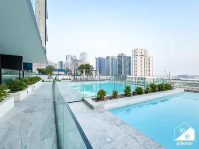 a swimming pool on the roof of a building at Luxury 2B with Balcony & Jaccuzi in Business Bay in Dubai