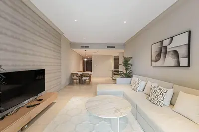 a living room with a couch and a table at Dubai Marina Marina Heights 2 beds Sleeps 4 in Dubai