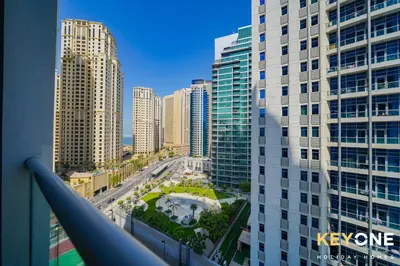 a view of a city with tall buildings at Magnificent Two Bedroom Beachfront in Dubai