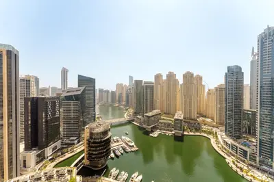 a view of a river in a city with tall buildings at Daniels 1BR at JW Marriott with Marina View in Dubai
