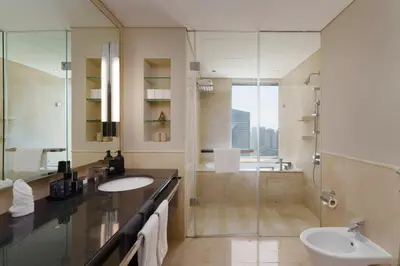 a bathroom with a sink and a shower at Daniels 1BR at JW Marriott with Marina View in Dubai