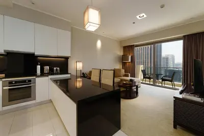 a kitchen and living room with a view at Daniels 1BR at JW Marriott with Marina View in Dubai
