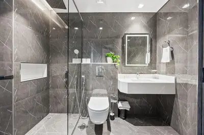 a bathroom with a toilet and a sink at 2 bedroom apartment with private pool in Dubai