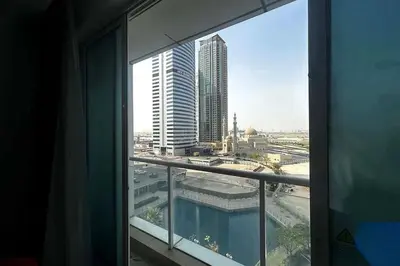a view of a city from a window in a building at Movenpick Apartment JLT in Dubai