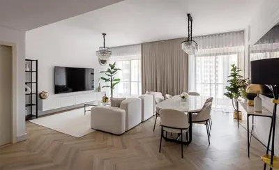 a white living room with a table and chairs at Spacious and luxurious 1 bed with amazing marina view!Rimal ! in Dubai