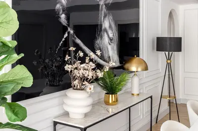 a living room with a table with flowers on it at Spacious and luxurious 1 bed with amazing marina view!Rimal ! in Dubai