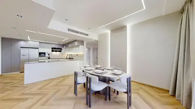 a kitchen and dining room with a table and chairs at Vacationer I Upgraded , Luxury 2 Bedroom Apartment Near JBR Beach, Prime Spot in Dubai