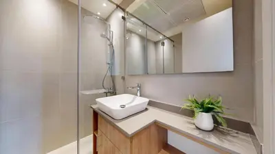 a bathroom with a sink and a mirror at Vacationer l Glamorous 2 Bedroom l Stunning Lake View l Free Wi-Fi in Dubai