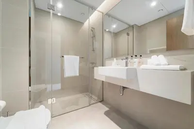a bathroom with a sink and a shower at 2BR with M CF7B Partial Canal View in Dubai