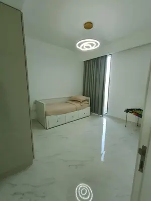 a room with a bed in the middle of a room at Dubai Hills Mahek Holiday Villa in Dubai