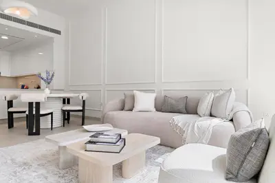 a living room with a couch and a table at 2BR with M CF7B Pet Friendly Stay in Dubai
