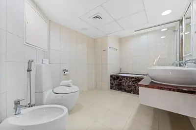 a bathroom with a toilet and a sink at Duplex 2BR next to Marina Beach in Dubai