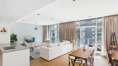 a living room with a white couch and a table at City Walk Building 16, Al Wasl, Jumeirah - Mint Stay in Dubai