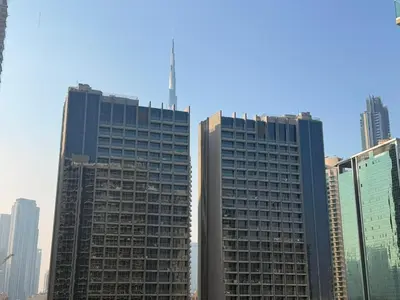 two tall buildings in a city with at Family Stay in Downtown 2BR Sleeps 6 Burj View in Dubai