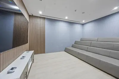 a waiting room with white benches and blue walls at Luxury 1BR Apt at LIV Marina with Direct Marina Views in Dubai