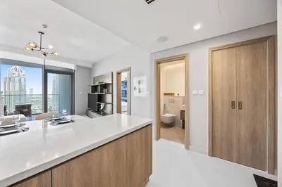 a kitchen with a sink and a counter top at Luxury 1BR Apt at LIV Marina with Direct Marina Views in Dubai