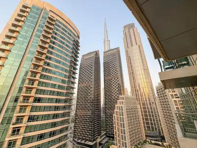 a group of tall buildings in a city at FIRST CLASS 1BR Central Dubai Luxury Living in Dubai