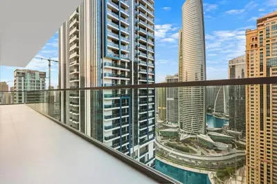 a view of a city from the balcony of a building at FIRST CLASS 3BR Elegant Comfort , Lake Views in Dubai