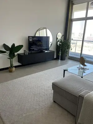 a living room with a couch and a mirror at Specious 1 bd close to Sea Jumeirah in Dubai
