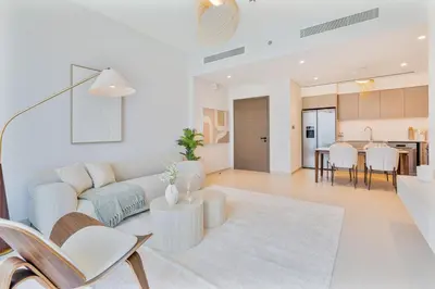 a living room with a couch and a table at 2Bed with spectacular Burj Khalifa & fountain view in Dubai