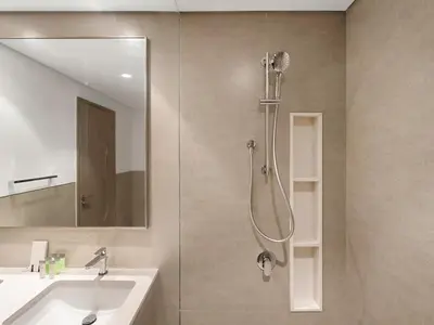 a bathroom with a shower and a sink at 2BR balcony Downtown with Burj Khalifa and Fountain View in Dubai