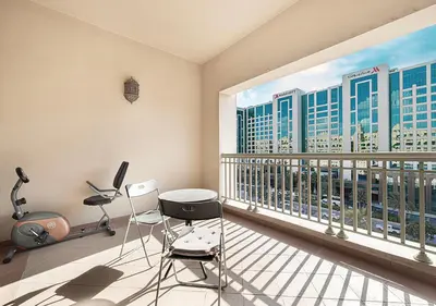 a balcony with a view of a city skyline at Cozy 2 Br Heart of Palm Jumeirah in Dubai