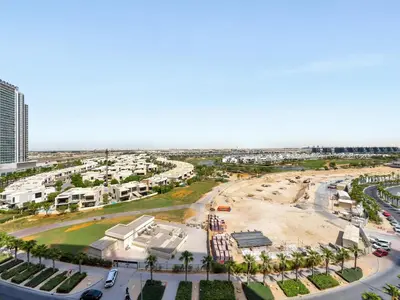 an aerial view of a parking lot in a city at Golf View Modern Comfort Perfect for 3 Guests in Dubai