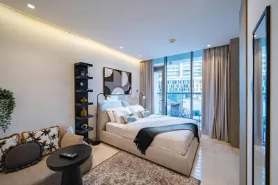 a bedroom with a large bed and a living room at Smart Studio in Business Bay Near Burj Khalifa in Dubai