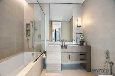 a bathroom with a tub and a sink and a shower at Deluxe 1 BR in The Address JBR Beachfront Access in Dubai