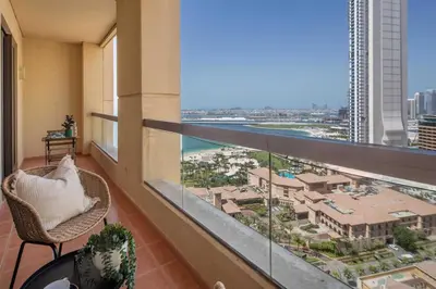 a balcony with a view of a resort at Frank Porter - Sadaf 7, JBR in Dubai