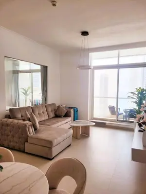 a living room with a couch and a large window at Apartment in Dubai Marina with Sea View & Balcony & Pool in Dubai