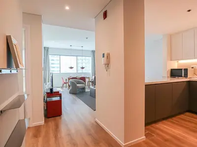 an open kitchen and living room in a apartment at HiGuests - 2 BR Escape Golf View Haven in The Greens in Dubai