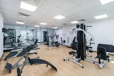 a gym with several treadmills and exercise bikes at Modern 2 Bedroom in Dubai Marina - Sea View in Dubai