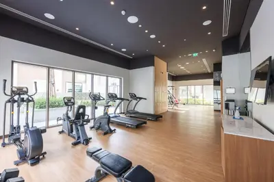 a gym with treadmills and cardio machines in a room at StayShort - Dubai Creek Harbour sleeps 6 in a Great Location in Dubai