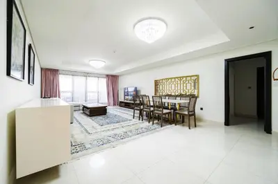a kitchen and dining room with a table and chairs at SettlerHomes - Seaside Lux Escape With Calm Sea View in Dubai