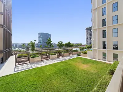 a view of a lawn in the middle of a building at Classic Luxe 2BDR in Collective in Dubai