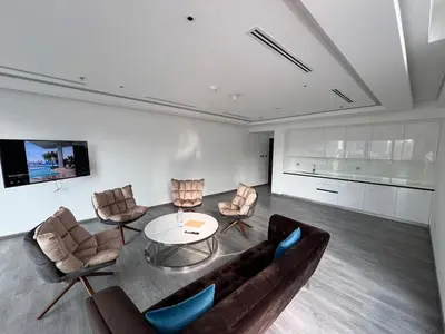 a living room with a couch and chairs and a table at Mahenti - Mesmerizing views of The Burj & Downtown Dubai in Dubai