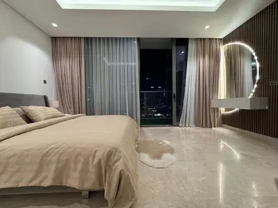a bedroom with a large bed and a large window at Mahenti - Mesmerizing views of The Burj & Downtown Dubai in Dubai