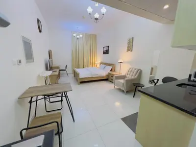a living room with a couch and a bed in a room at Mahenti - Elite 1 · Large balcony with all u need in Dubai