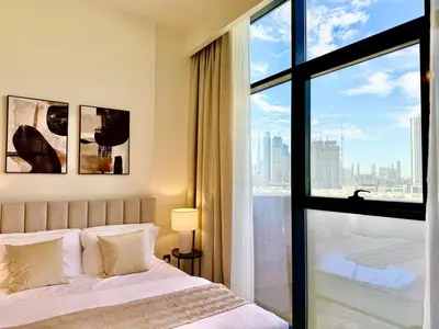 a bedroom with a bed and a large window at Mahenti- Chic 1BR with Burj & Downtown View in Dubai