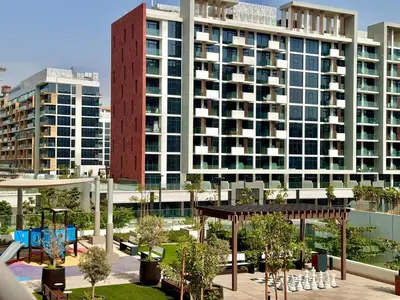 a large building with tall buildings in a city at Mahenti- Chic 1BR with Burj & Downtown View in Dubai