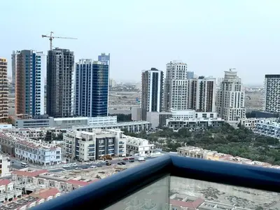 a view of a city skyline with tall buildings at Mahenti - Sunlit Spacious Apartment in JVC in Dubai