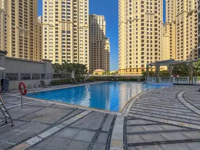 a swimming pool in a city with tall buildings at Frank Porter - Aurora Tower, Dubai Marina in Dubai