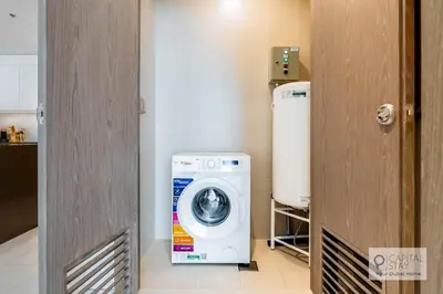 a washer and dryer in a small room at Capital Stay - 1 Bed Apt in MBR City in Dubai