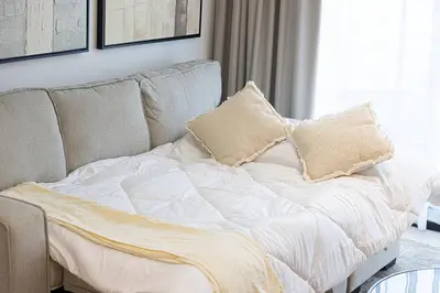 a bed with two pillows on it in a room at Deluxe Binghatti JVC Suites by Hostiva - City View in Dubai