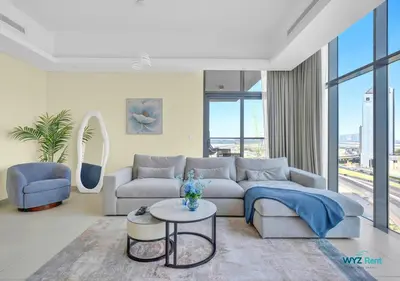 a living room with a couch and a table at Spacious and Luxurious 2 BD in Downtown Sleeps 8 with Maid Room in Dubai