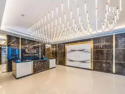 a lobby of a luxury hotel with a chandelier at Spacious 1 Bed with Burj Khalifa View accommodates 3 or 4 in Dubai