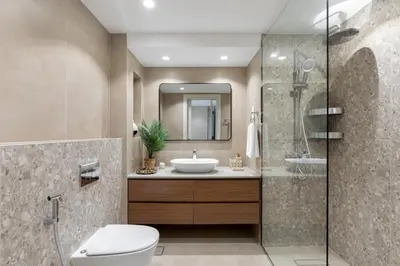 a bathroom with a toilet and a sink at Maison Privee - Chic Downtown Living with Dubai Cityscape Views in Dubai