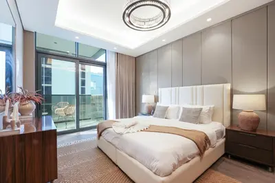 a bedroom with a large bed and a large window at Trophy Soft tones sharp style Masterpiece 705 in Dubai